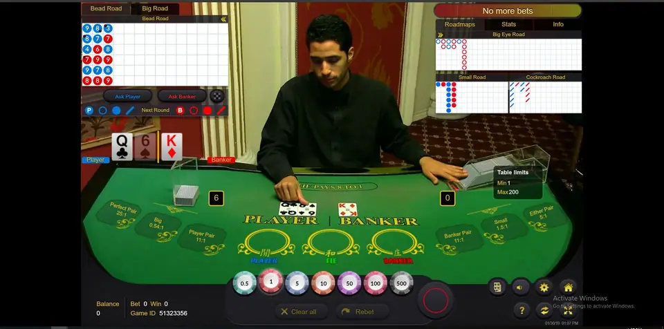 Ezugi live baccarat with a dealer behind a green PLAYER and BANKER felt, roadmap panels at the top and a chip row from 0.5 to 500