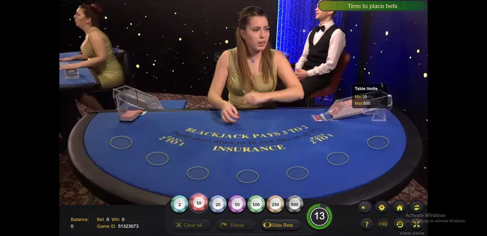 Seated blue-felt table with seven spots, Table limits Min 10 Max 500 and a countdown at 13