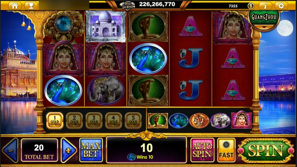 The Taj Majestic peacock win: peacocks on reels 1 and 3 with the Taj Mahal tile on reel 2, message box showing a peacock icon and Wins 10 at bet 20